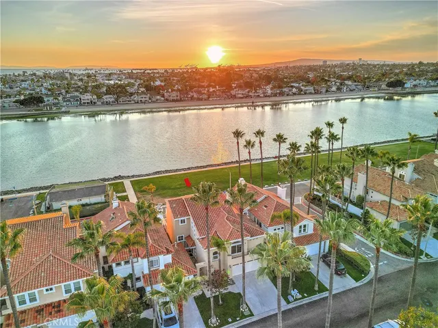 an aerial view of residential building with outdoor space and lake view