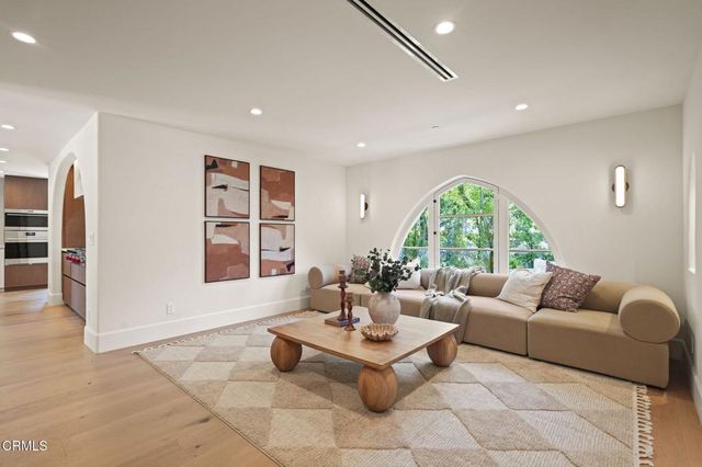 a kitchen with stainless steel appliances granite countertop a stove and a refrigerator
