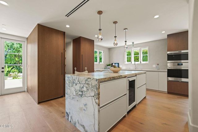 a kitchen with a sink and a window