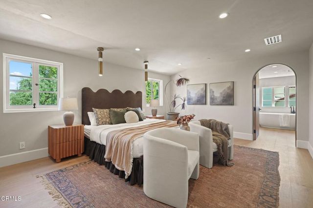 a living room with furniture and windows