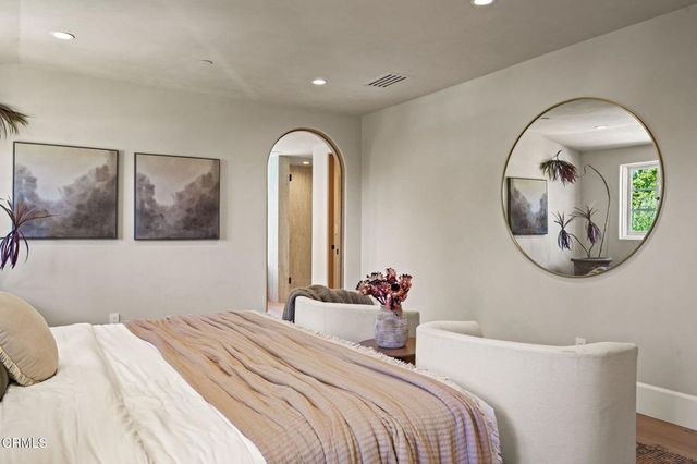 a white tub sitting next to a window