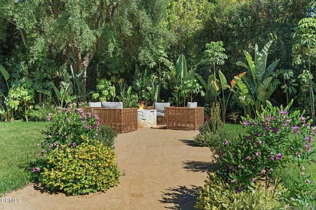 an outdoor living area with furniture and a couch