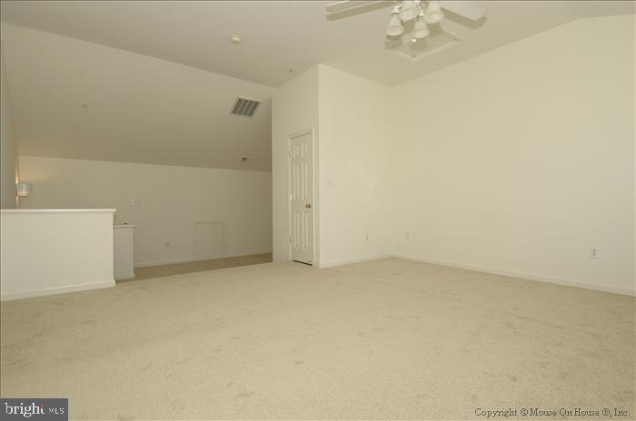 52 Golden Ash Way Gaithersburg, MD 20878 - Photo 12 of 31 an empty room with a chandelier fan