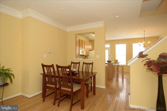 52 Golden Ash Way Gaithersburg, MD 20878 - Photo 3 of 31 a view of a dining room with furniture and wooden floor