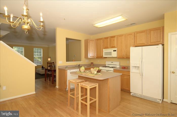52 Golden Ash Way Gaithersburg, MD 20878 - Photo 6 of 31 a kitchen with a stove a refrigerator and a sink