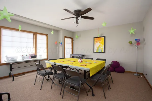 a dining room with furniture and window