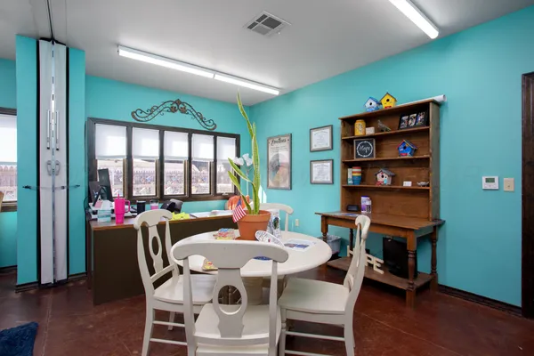 a view of a dining room with furniture large window and wooden floor