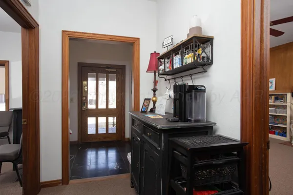 a view of a livingroom with furniture and staircase