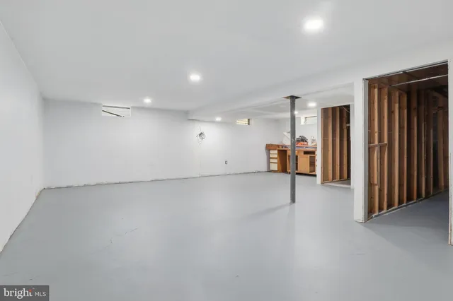 a view of a house with backyard porch and sitting area