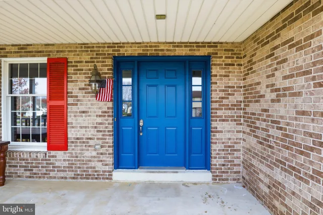a front view of a house with a glass door