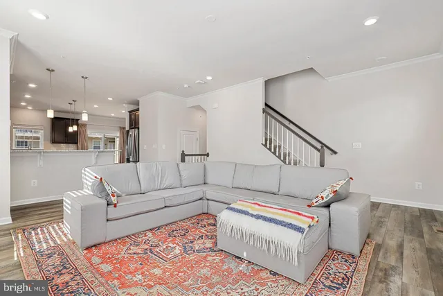 a living room with furniture and a rug