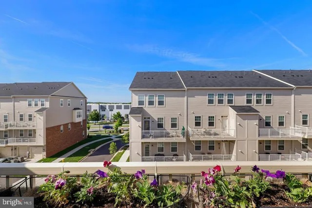 a view of multiple houses with a city street