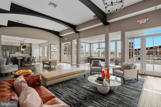 a living room with furniture or couch and a large window