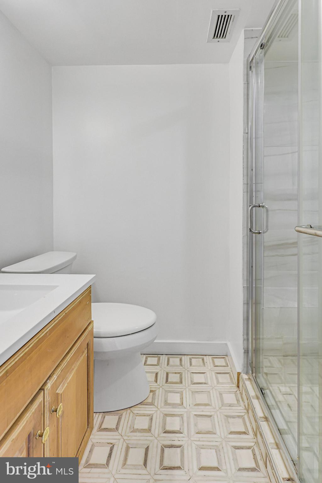 1245 4th Street Southwest, Unit E711 Washington, DC 20024 - Photo 17 of 33 a bathroom with a toilet and a shower