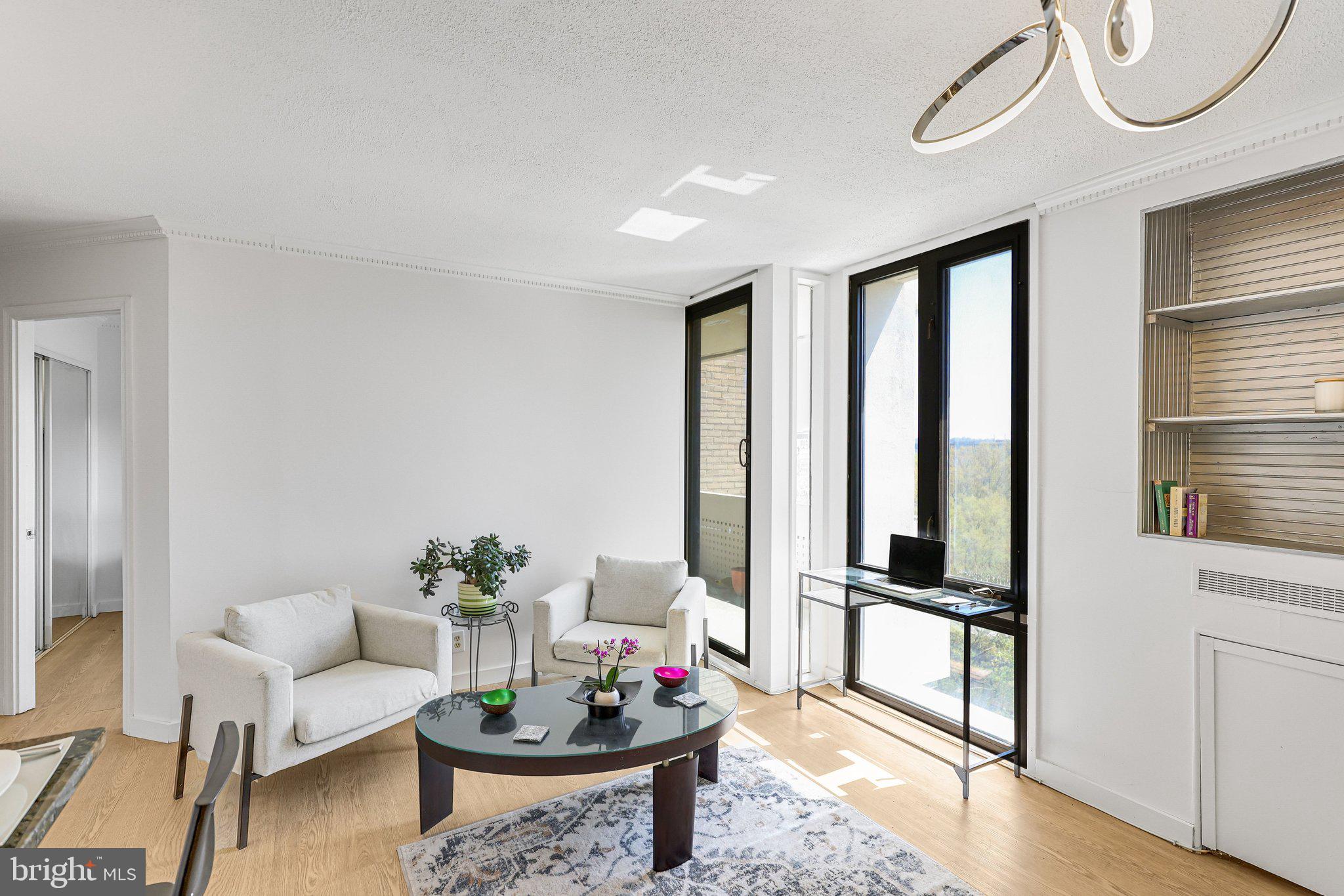 1245 4th Street Southwest, Unit E711 Washington, DC 20024 - Photo 6 of 33 a living room with furniture
