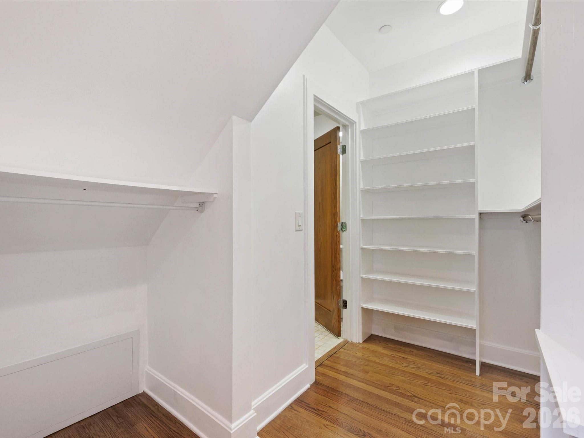 420 Queens Road Charlotte, NC 28207 - Photo 26 of 35 a view of walk in closet with empty racks