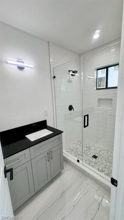 871 Southwest 2nd Street Homestead, FL 33034 - Photo 7 of 12 a bathroom with a granite countertop sink a mirror and shower