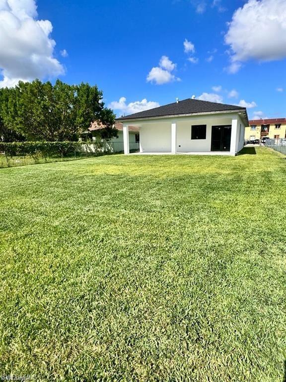 871 Southwest 2nd Street Homestead, FL 33034 - Photo 10 of 12 a view of a house with a yard