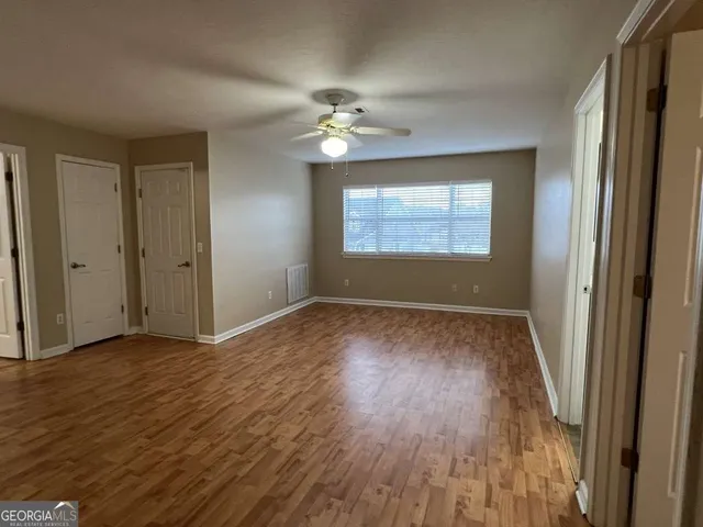 a view of livingroom with hardwood floor and hallway