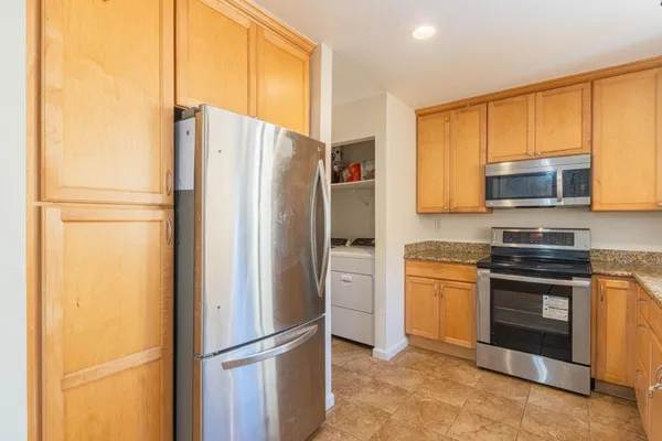 a kitchen with a sink and a large window