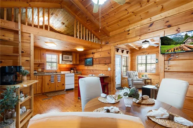 a view of a kitchen with seating area