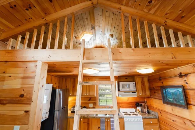 a kitchen with a refrigerator and a stove