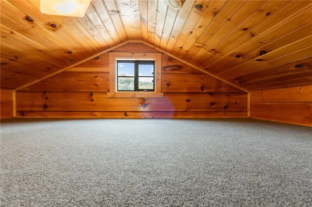 a view of a dining room with furniture and window
