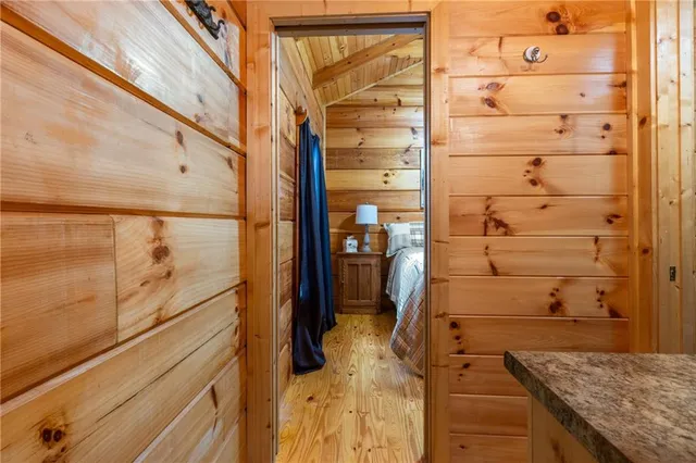 a bedroom with a bed and a shower