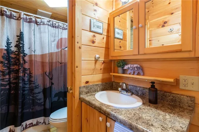 a picture of a bench in front of a wall