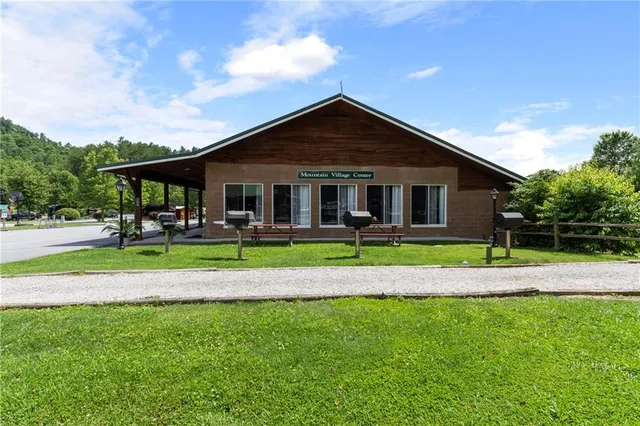 a view of a park with swings and slides