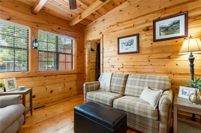 a living room with furniture a wooden floor and a table