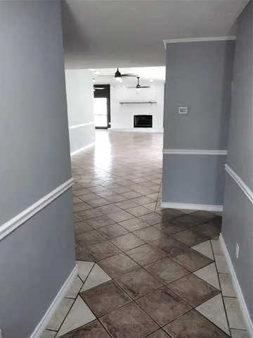 a view of a refrigerator in kitchen and window