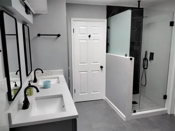 a bathroom with a sink and mirror