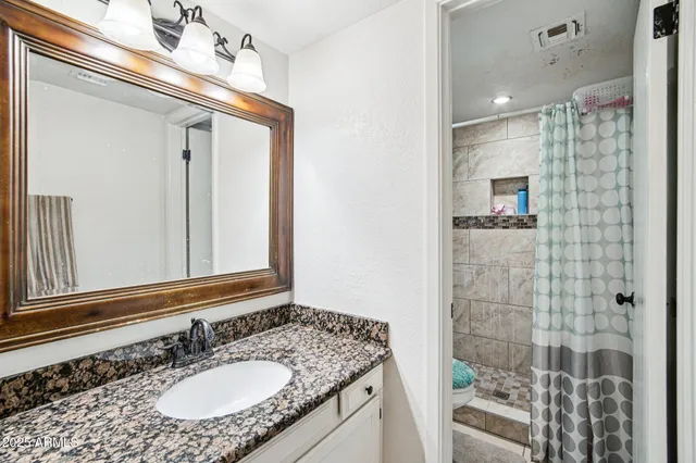 a bedroom with a bed and furniture