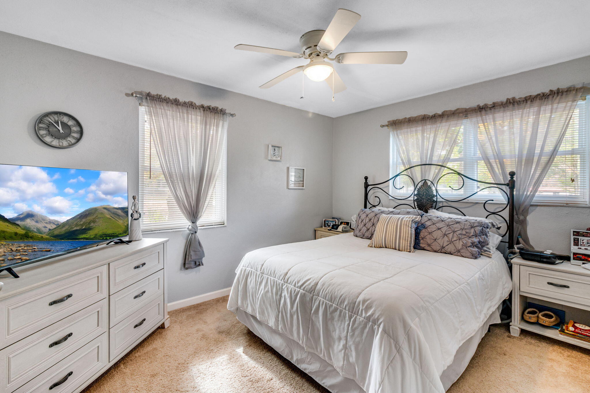 103 Adkinson Drive Crestview, FL 32536 - Photo 13 of 19 a bedroom with a bed and a flat screen tv