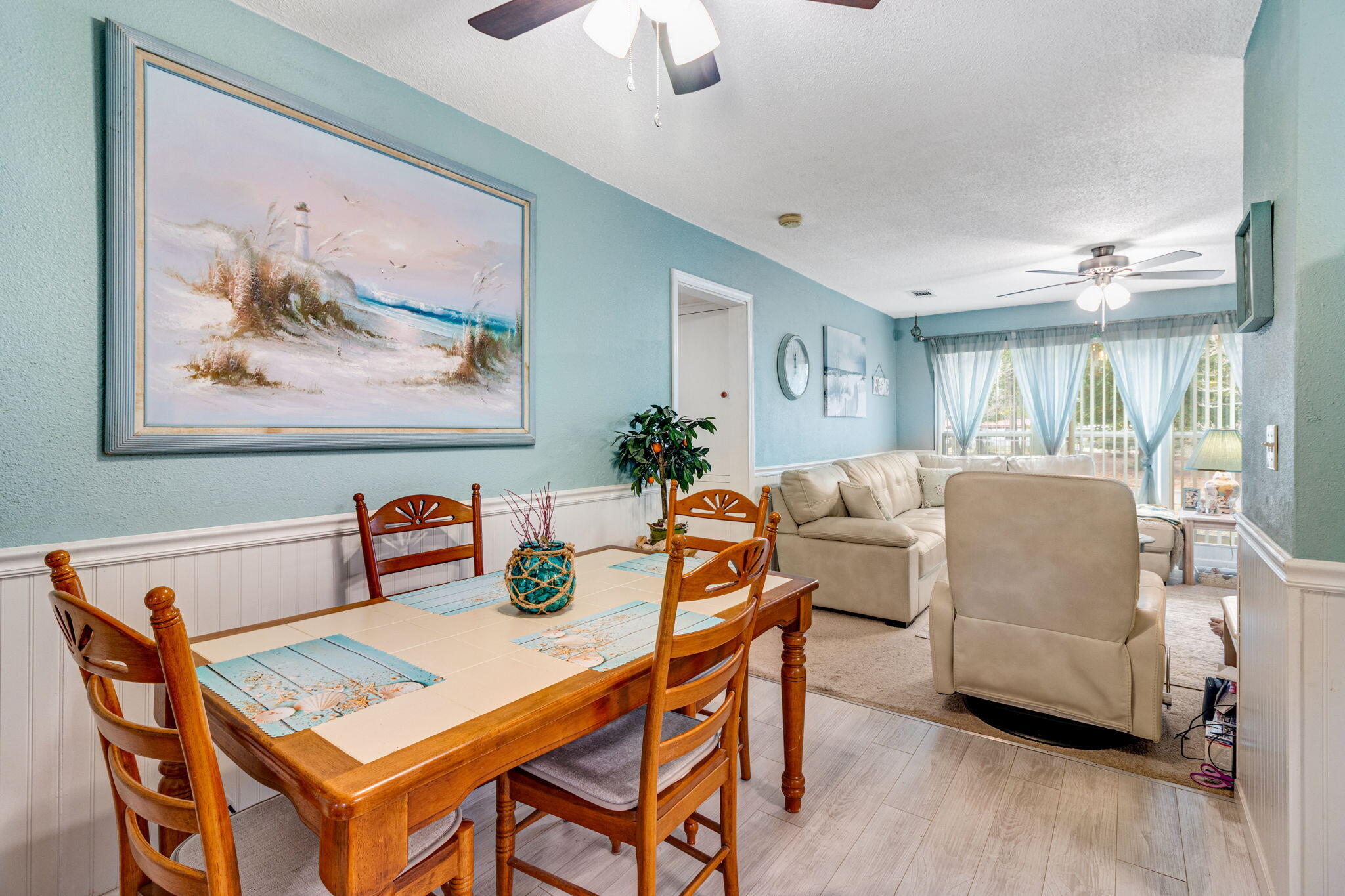103 Adkinson Drive Crestview, FL 32536 - Photo 7 of 19 a living room with furniture and a wooden floor