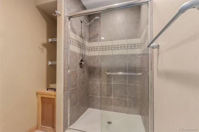 a bathroom with a glass shower door