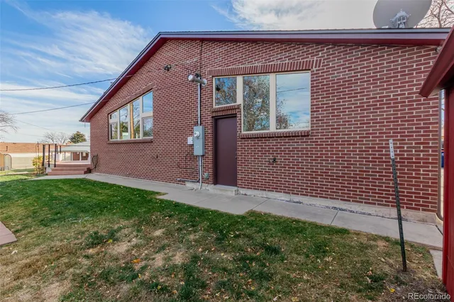 a view of a house with a wooden deck