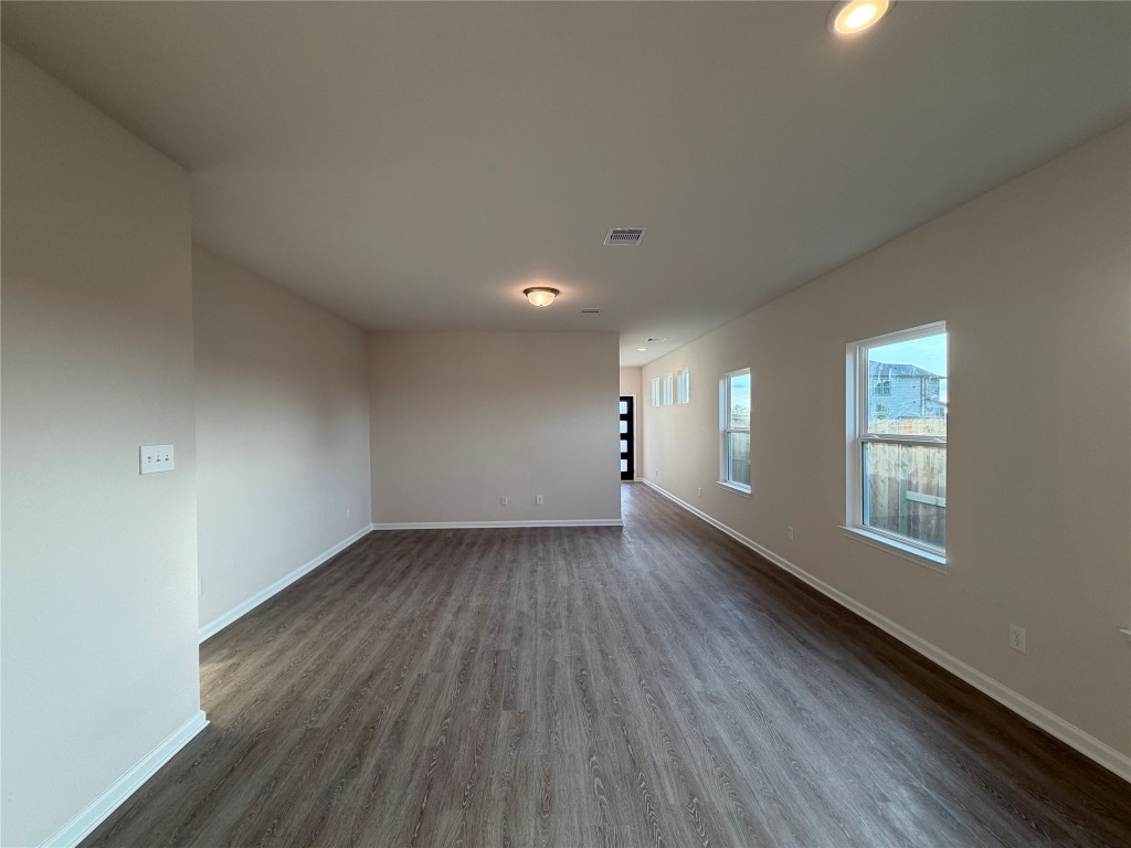 429 Stone Placa Trail Pattison, TX 77423 - Photo 8 of 17 an empty room with wooden floor and windows