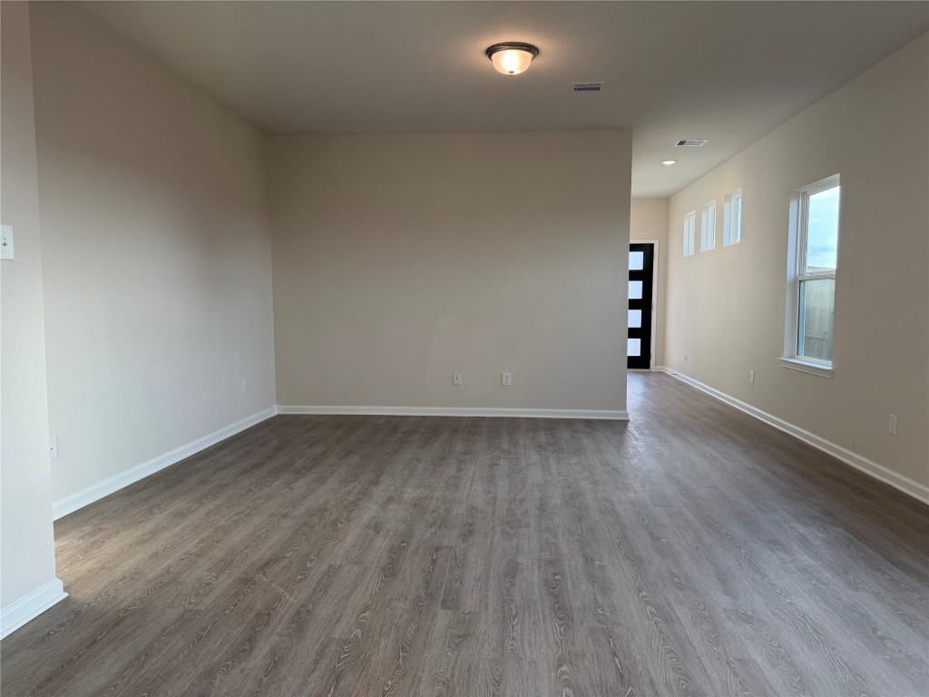 429 Stone Placa Trail Pattison, TX 77423 - Photo 9 of 17 an empty room with wooden floor and windows