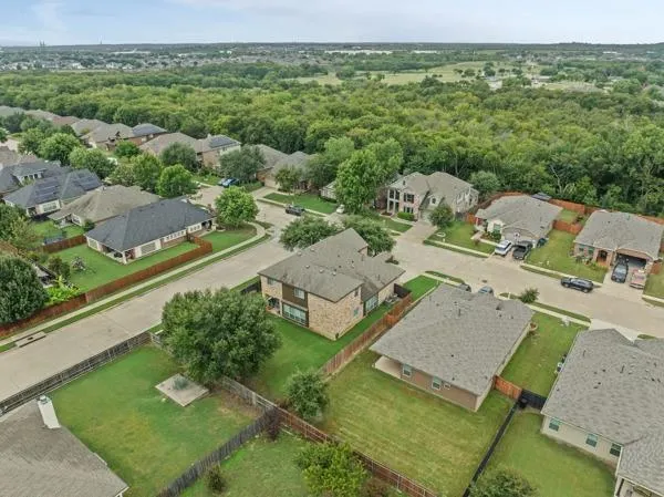 an aerial view of a house with a garden