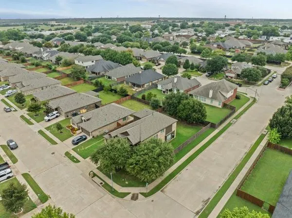 an aerial view of a house with a garden