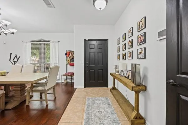 a living room with furniture and a kitchen