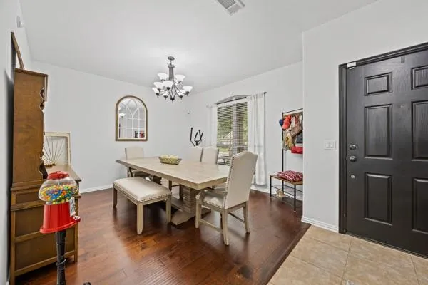 a view of a livingroom with furniture and chandelier