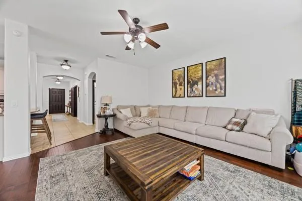 a living room with furniture and a rug