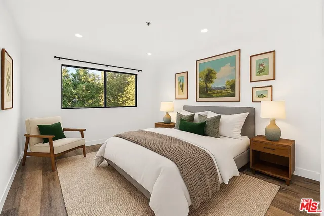 a bedroom with bed and a couch