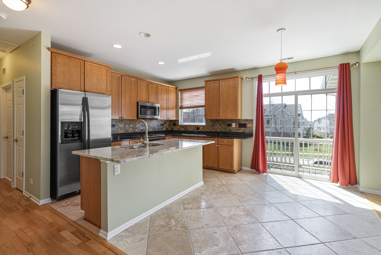 1388 Scarboro Road, Unit 1103 Schaumburg, IL 60193 - Photo 3 of 17 a kitchen with stainless steel appliances granite countertop a refrigerator a sink a stove top oven and a refrigerator
