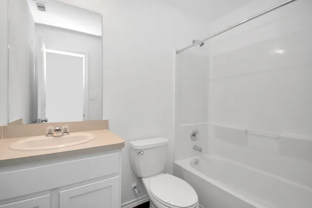 a bathroom with a sink toilet and bathtub