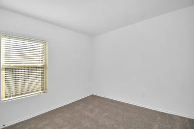 a view of a room that has a window in it