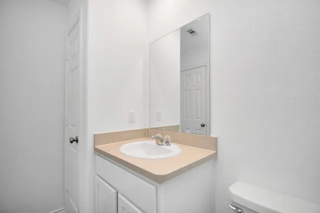 a bathroom with a sink and a toilet